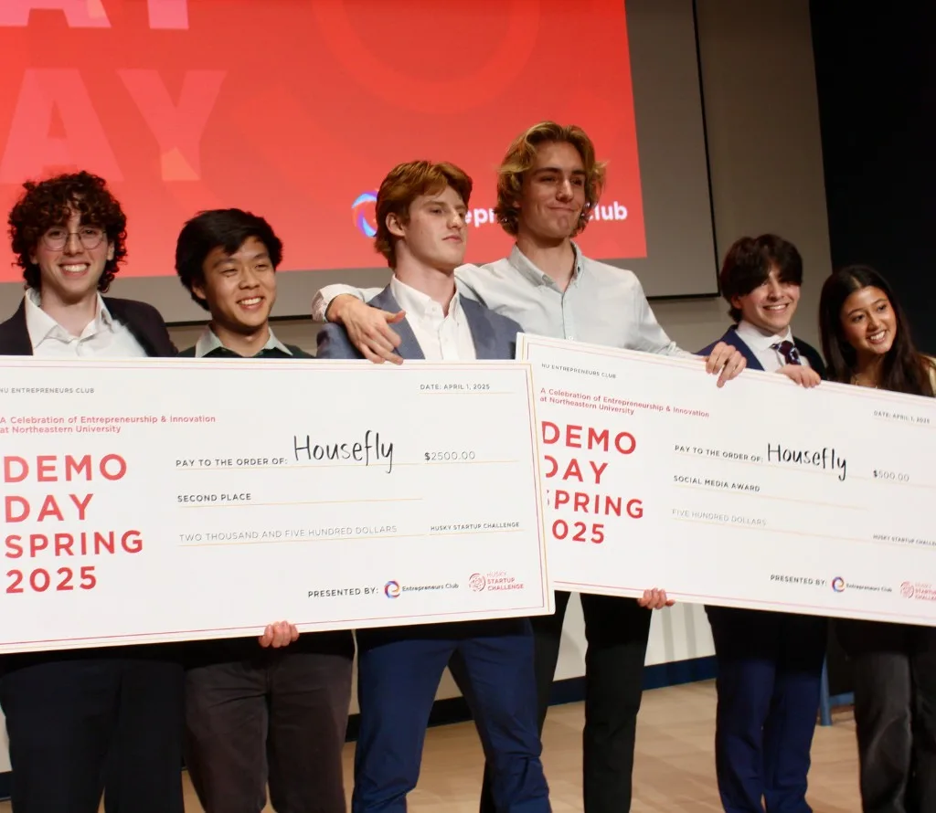 HouseFly team holding DEMO Day award checks at Northeastern